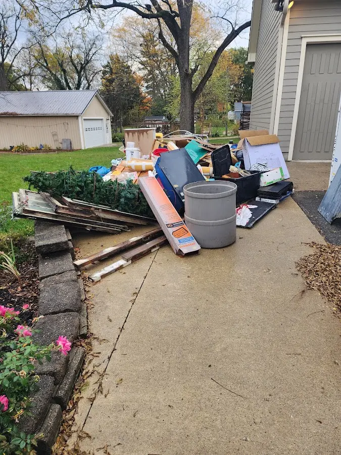 Dumpster being loaded with debris for Roofing Dumpster Rental in Truckee